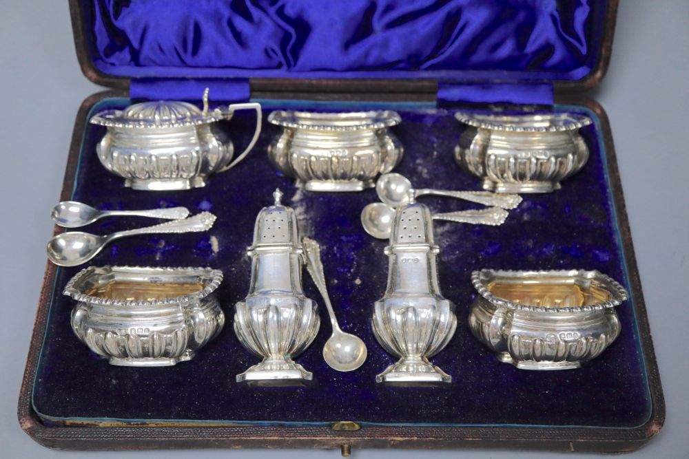 A late Victorian cased silver seven piece condiments set and five spoons (one associated), John Round, Sheffield, 1896.